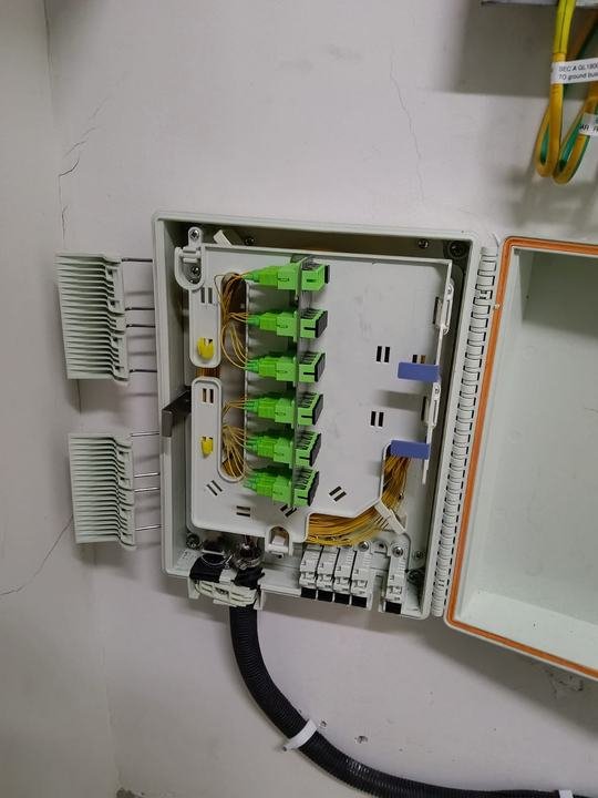 Wall box with spare adapters and the drop cable entry