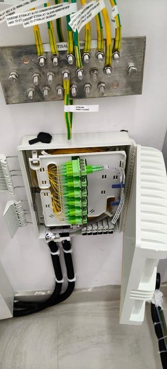 Grounding bar above a fiber wall box