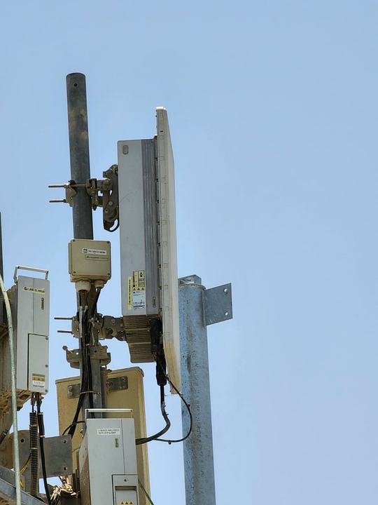 RRU and antennas on a rooftop pole